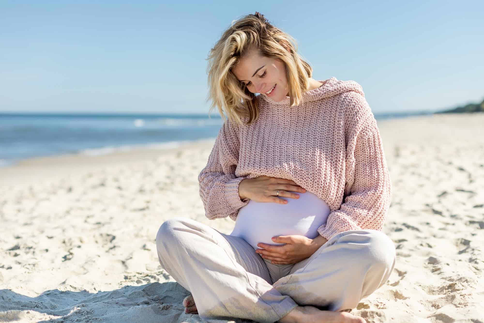 Relaxing on beach during pregnancy